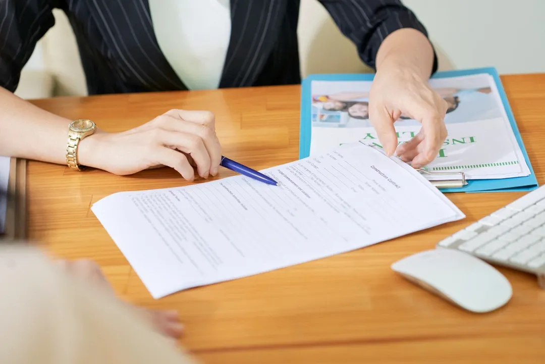 Desk with paperwork illustrating the application process for business licenses