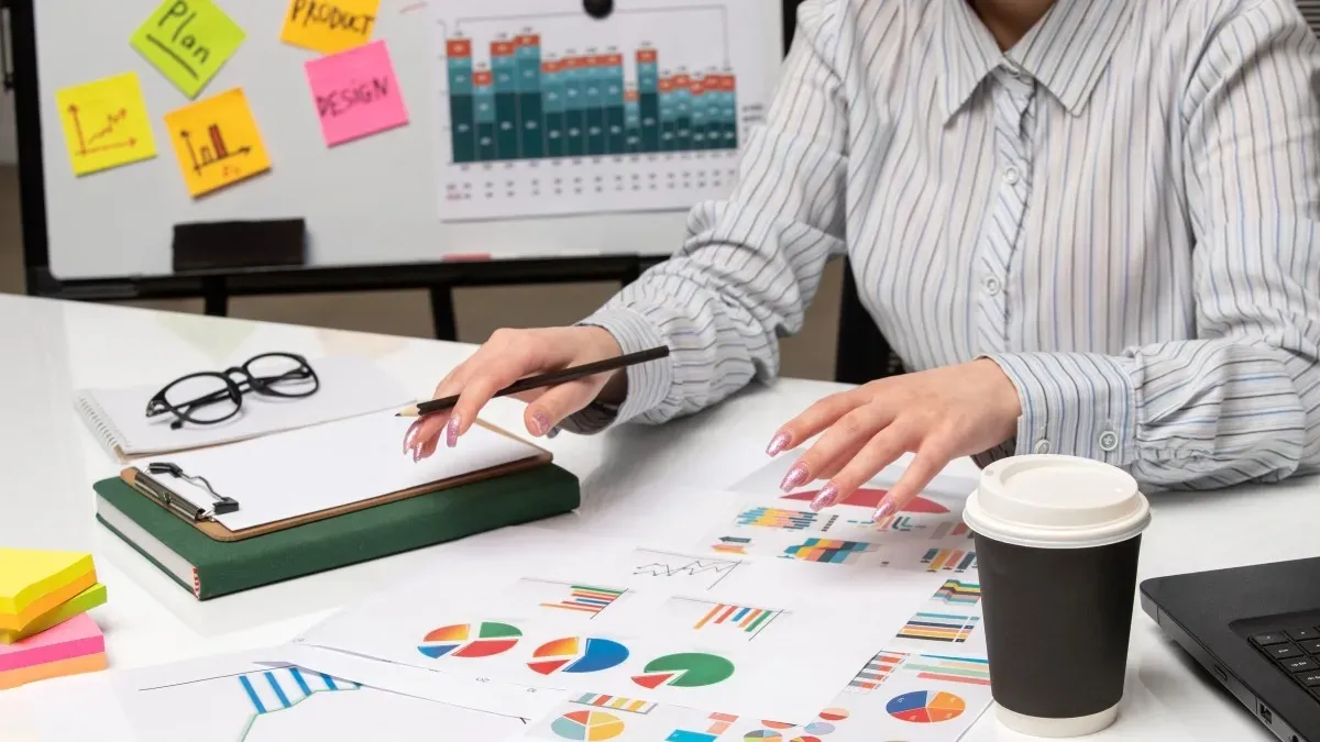 Conducting venue rental market research with printed analytics and graphs